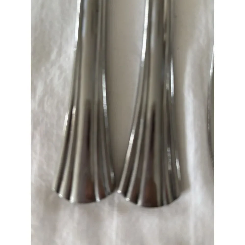 Stainless steel flatware. 7 pieces knives not sure of brand or style very heavy.